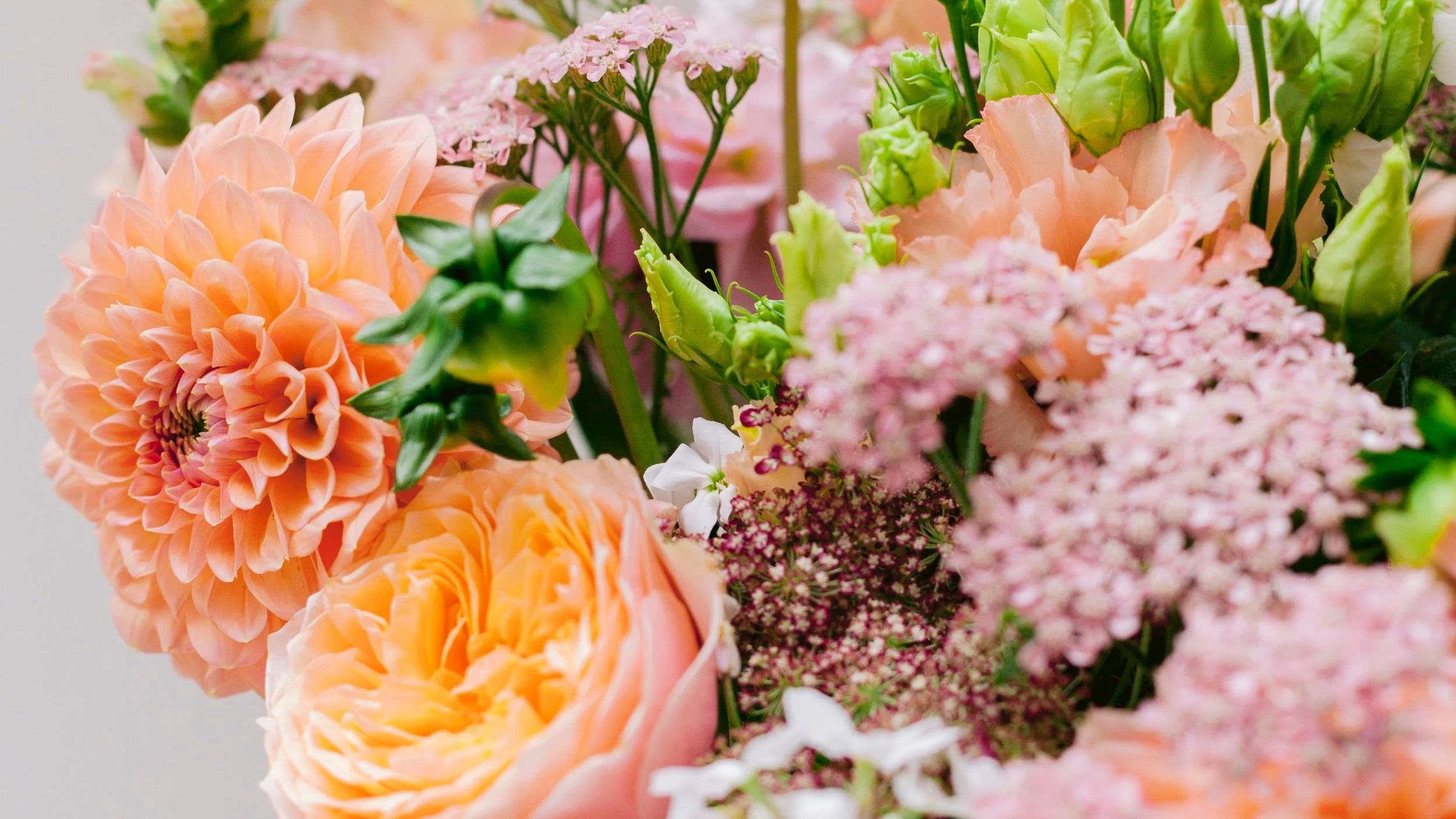 An abundant seasonal arrangement of garden flowers by Bramble & Willow