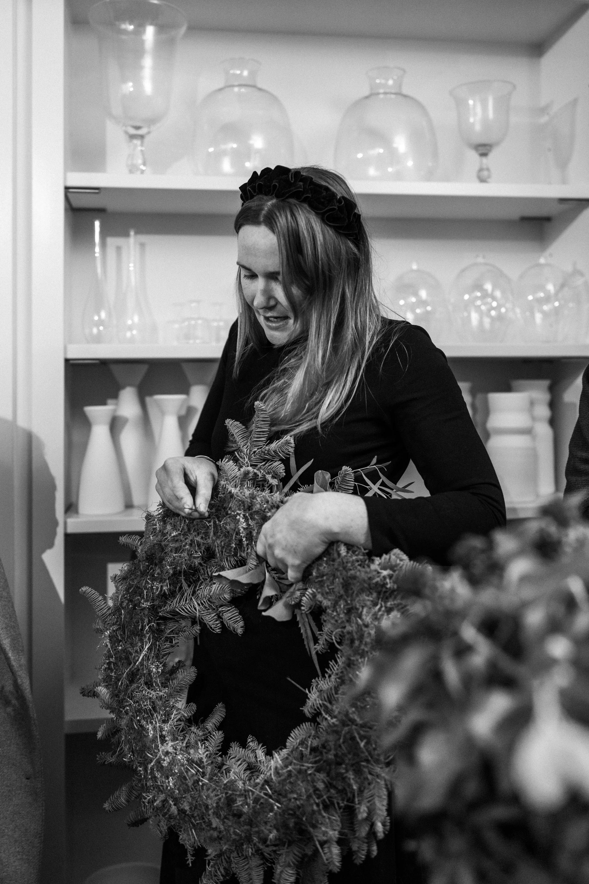 Bramble & Willow floral designer working with seasonal stems in the studio